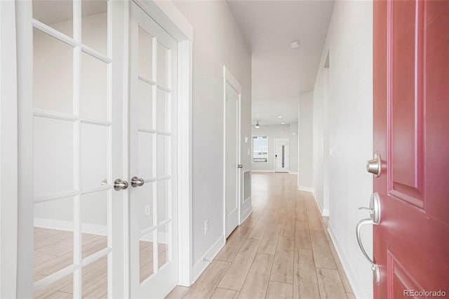 20968 E 60th Pl, Aurora, CO 80019 - hallway with light wood-type flooring and baseboards