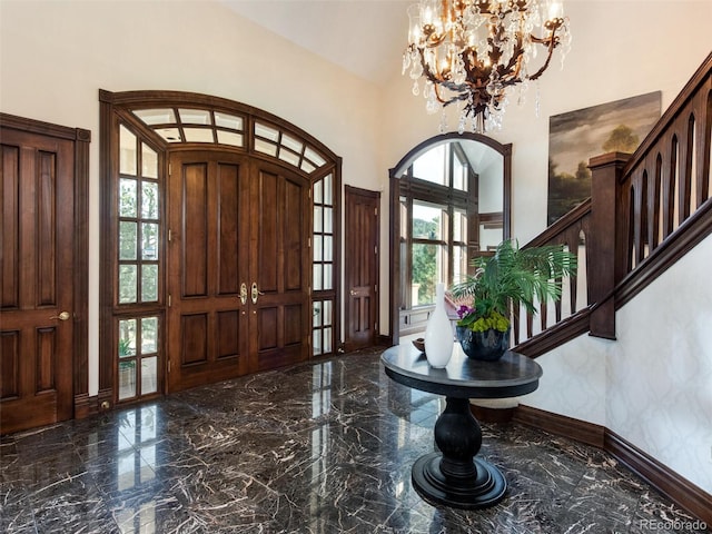 1189 Rembrandt Rd, Boulder, CO 80302 - entryway with marble tiled floors, plenty of natural light, a towering ceiling, and a chandelier