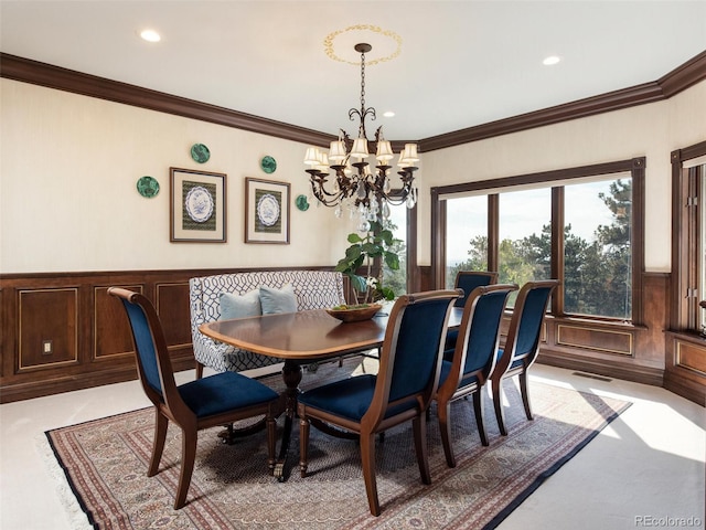 1189 Rembrandt Rd, Boulder, CO 80302 - dining room with a chandelier, ornamental molding, wainscoting, recessed lighting, and a decorative wall