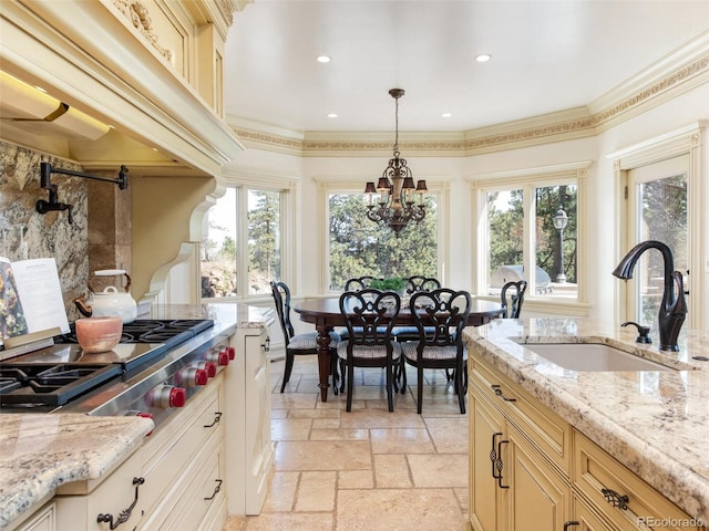 1189 Rembrandt Rd, Boulder, CO 80302 - kitchen featuring healthy amount of natural light, stainless steel gas cooktop, a chandelier, stone tile floors, and recessed lighting