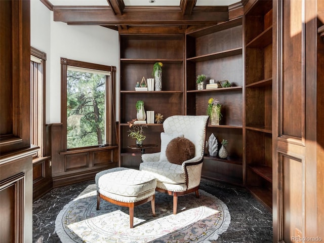 1189 Rembrandt Rd, Boulder, CO 80302 - living area featuring dark marble finish floors, built in shelves, beam ceiling, wainscoting, and coffered ceiling