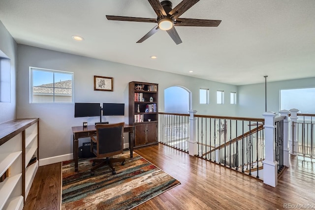 office space with dark wood-type flooring