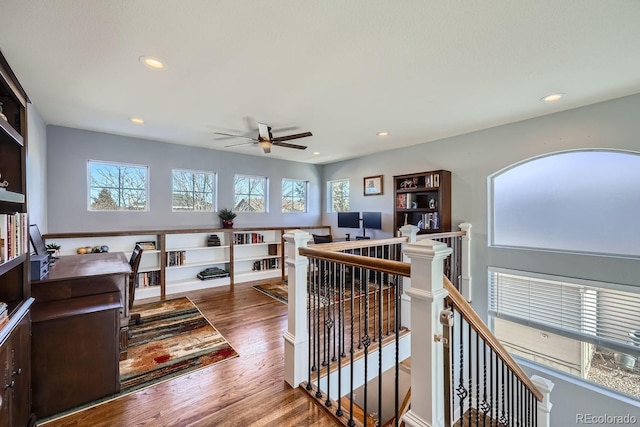 interior space with hardwood / wood-style flooring, ceiling fan, and plenty of natural light