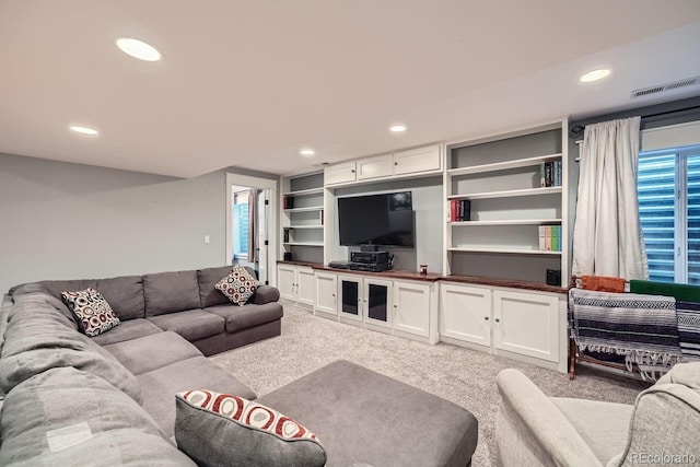 living room featuring light colored carpet