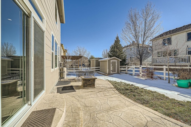 view of patio with a storage unit