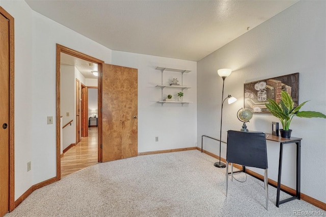 office space featuring baseboards and carpet floors