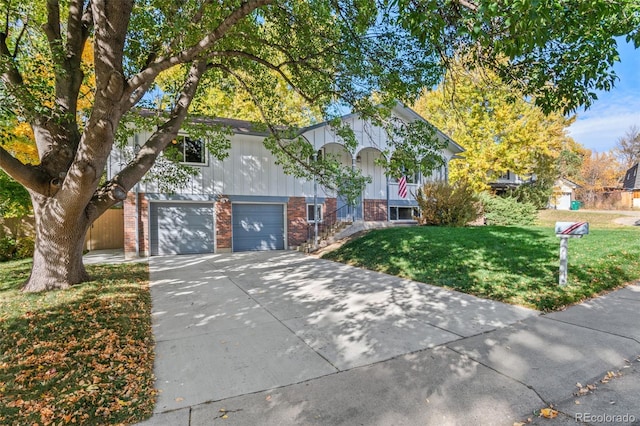 view of front of home with a front yard and a garage