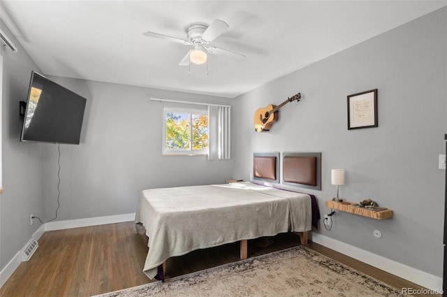 bedroom featuring hardwood / wood-style floors and ceiling fan