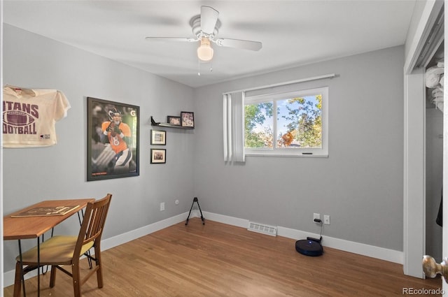 office area with hardwood / wood-style floors and ceiling fan