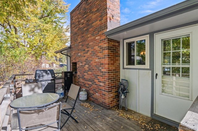 wooden terrace featuring grilling area