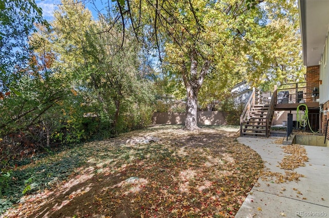 view of yard featuring a wooden deck