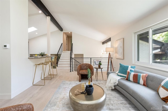 7453 E Jefferson Dr, Denver, CO 80237 - living room with wood finished floors, a skylight, and recessed lighting