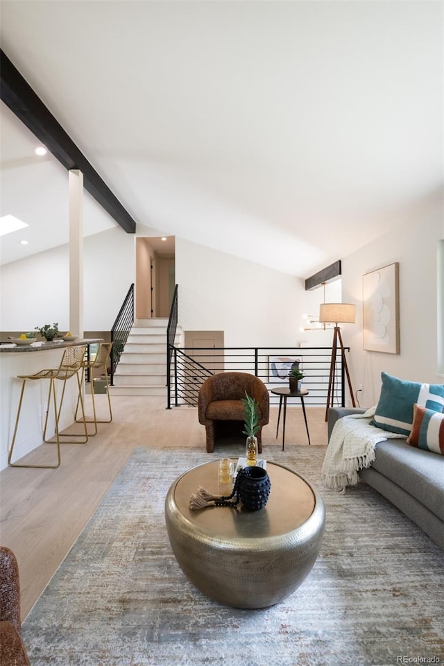 7453 E Jefferson Dr, Denver, CO 80237 - living area with wood finished floors, beam ceiling, and recessed lighting