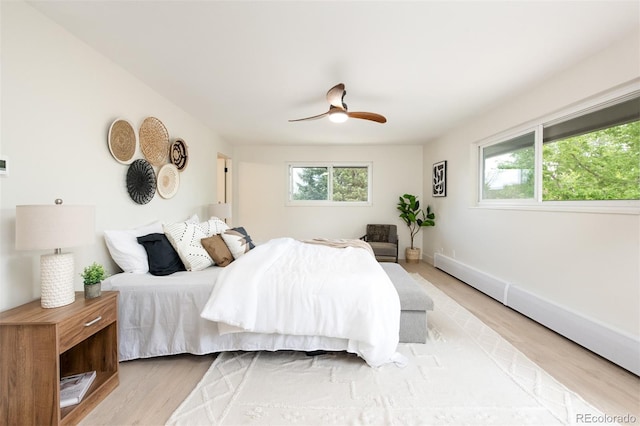 7453 E Jefferson Dr, Denver, CO 80237 - bedroom featuring multiple windows, light wood-style floors, and ceiling fan
