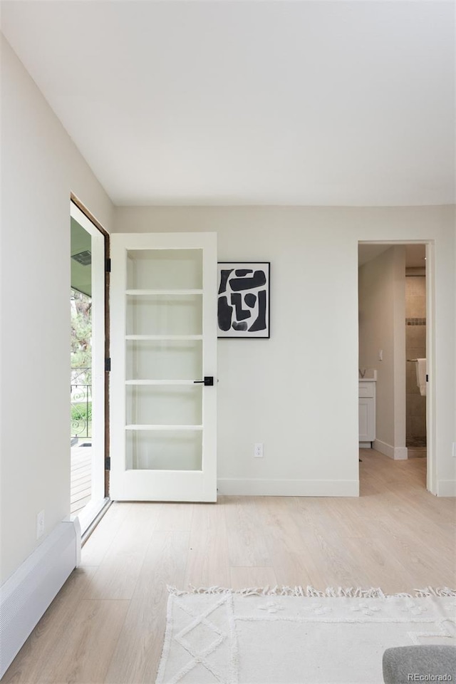 7453 E Jefferson Dr, Denver, CO 80237 - spare room with wood finished floors and baseboards