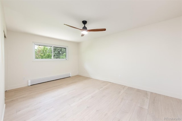 7453 E Jefferson Dr, Denver, CO 80237 - spare room featuring a baseboard radiator, ceiling fan, and light wood-type flooring