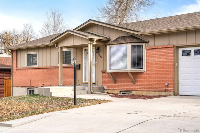 ranch-style home featuring a garage