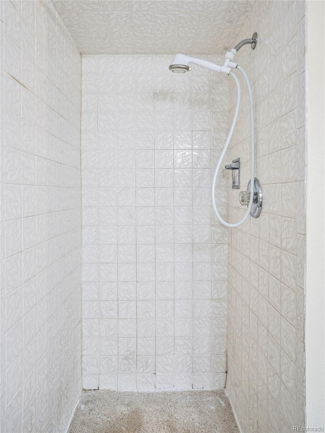 bathroom with tiled shower