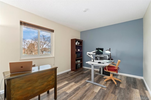 office with wood finished floors and baseboards