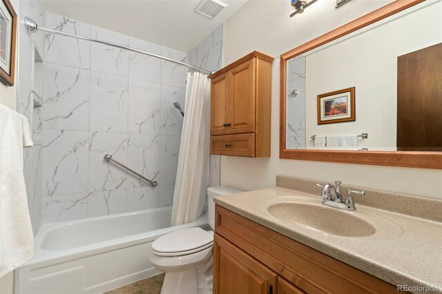 full bathroom featuring toilet, shower / tub combo, visible vents, and vanity