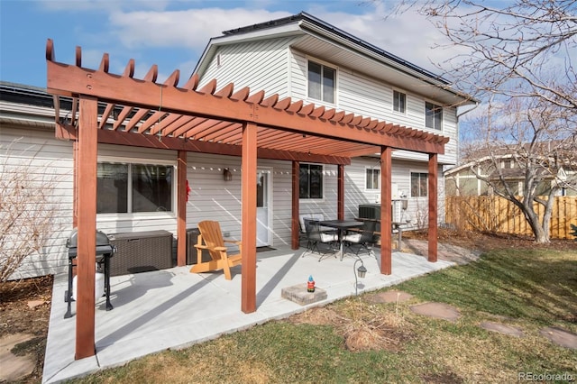 rear view of property with cooling unit, a patio area, fence, and a pergola