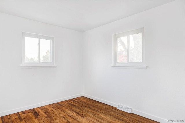 unfurnished room featuring hardwood / wood-style floors