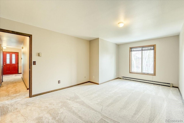 spare room featuring light colored carpet, baseboards, plenty of natural light, and baseboard heating