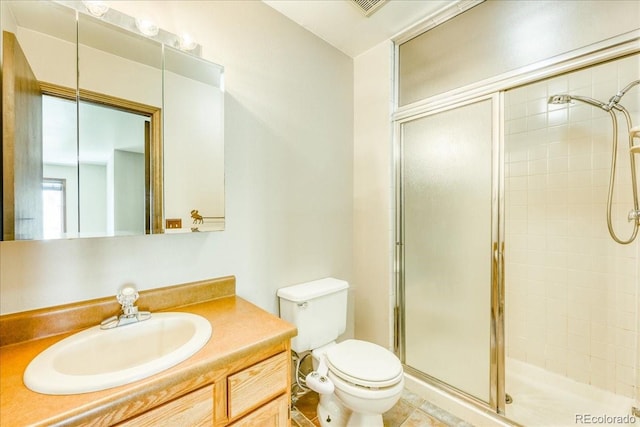 full bath featuring vanity, toilet, and a stall shower