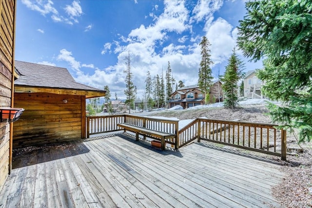 wooden deck featuring a residential view