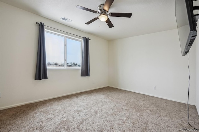 carpeted empty room with ceiling fan