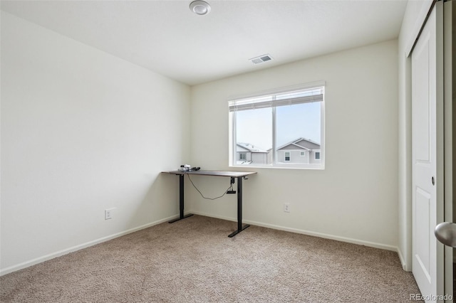 interior space with carpet floors and a closet