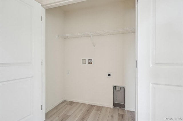 laundry area featuring washer hookup, light hardwood / wood-style floors, and hookup for an electric dryer