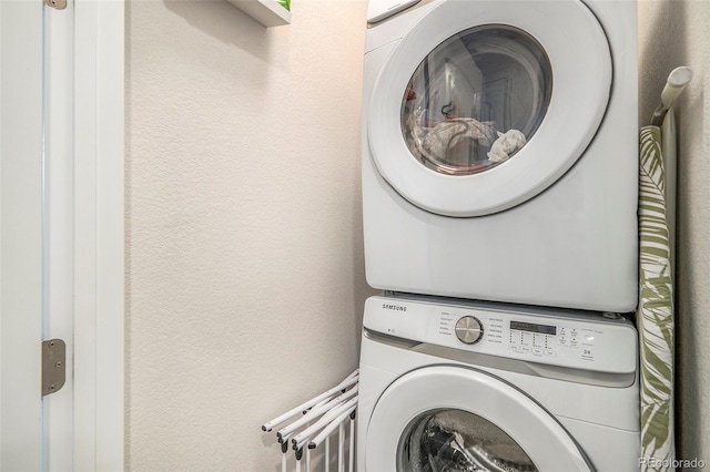 washroom with stacked washer / dryer