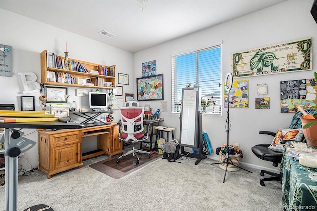 office area featuring light carpet