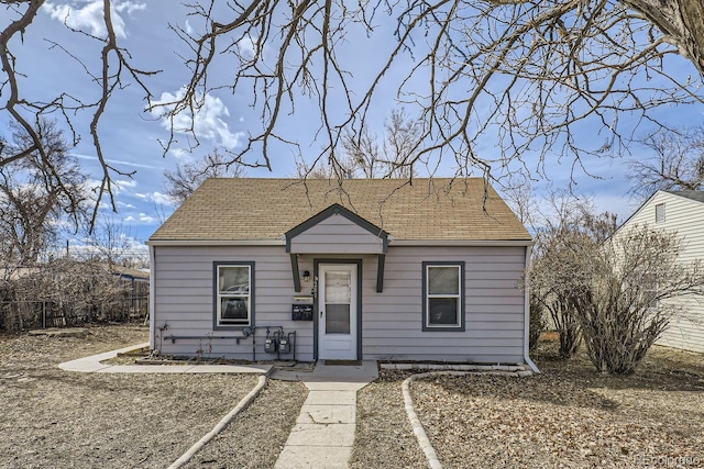 bungalow-style home featuring a shingled roof