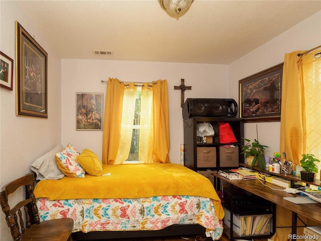 bedroom featuring visible vents