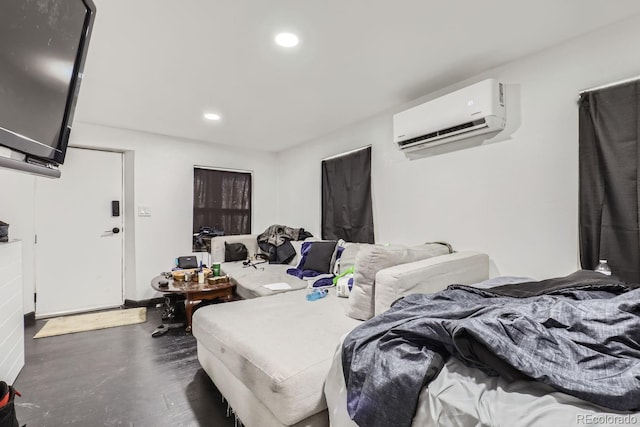 bedroom featuring a wall unit AC and recessed lighting