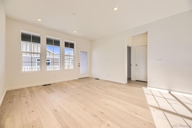 unfurnished room featuring light hardwood / wood-style flooring