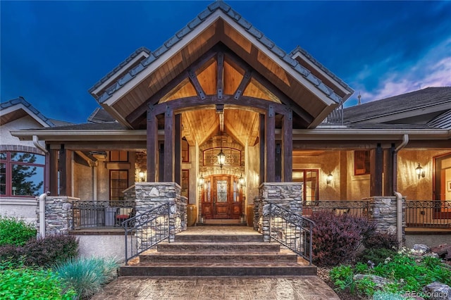 exterior entry at dusk with a porch