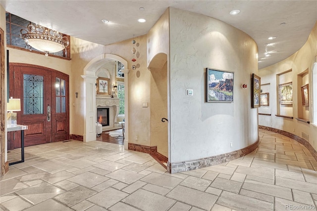 foyer entrance featuring a towering ceiling