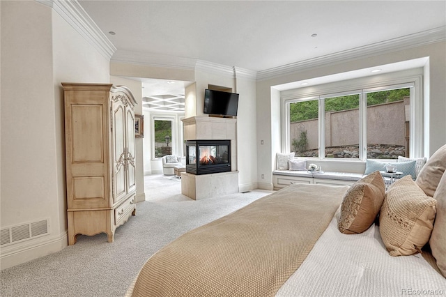 bedroom featuring a multi sided fireplace, light carpet, and crown molding