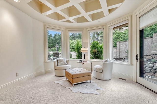 sunroom / solarium featuring beamed ceiling and coffered ceiling