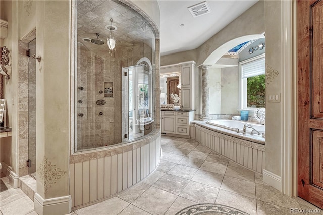 bathroom featuring plus walk in shower, vanity, and decorative columns