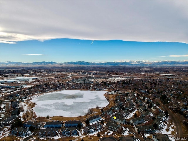 birds eye view of property featuring a mountain view