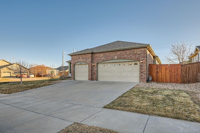 view of side of home featuring a garage