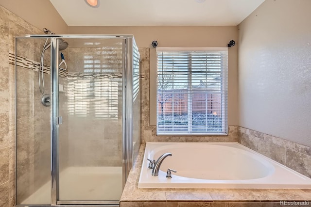 bathroom with separate shower and tub