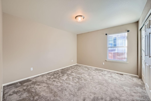 unfurnished room with carpet