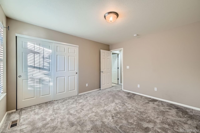 unfurnished bedroom with light carpet