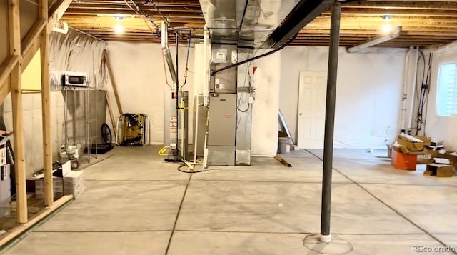 basement with heating unit and water heater