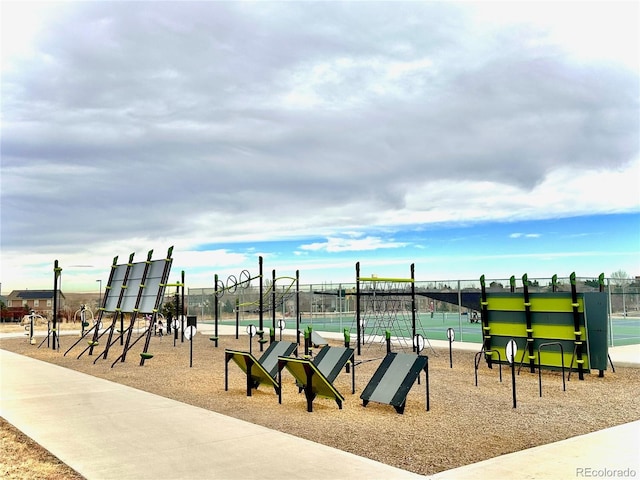 view of playground featuring tennis court